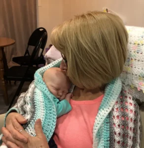 Cradling with Grandma - Grace Fox